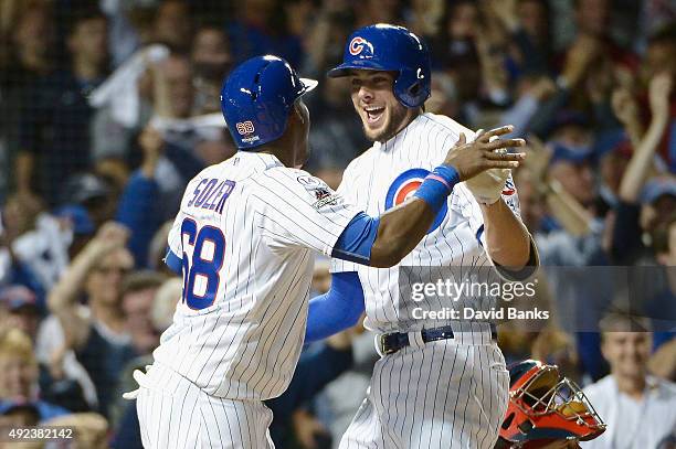 Kris Bryant of the Chicago Cubs celebrates with Jorge Soler of the Chicago Cubs after hitting a two-run home run in the fifth inning against the St....