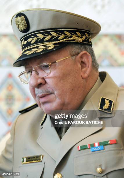 Algeria's Chief of Staff General Ahmed Gaid Salah speaks with French Defence Minister Jean-Yves Le Le Drian upon his arrival at the Houari-Boumediene...