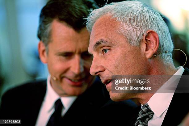 Urs Rohner, chairman of Credit Suisse Group AG, right, speaks with Philipp Hildebrand, vice chairman of BlackRock Intl., prior to the Swiss...