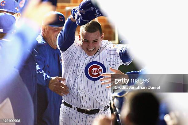 Anthony Rizzo of the Chicago Cubs celebrates in the dugout after hitting a solo home run in the fifth inning against the St. Louis Cardinals during...