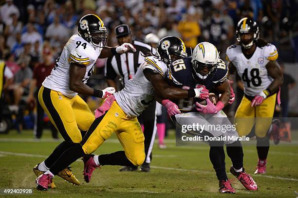 Tight end Antonio Gates of the San Diego Chargers is tackled by inside linebacker Sean Spence of the Pittsburgh Steelers at Qualcomm Stadium on...