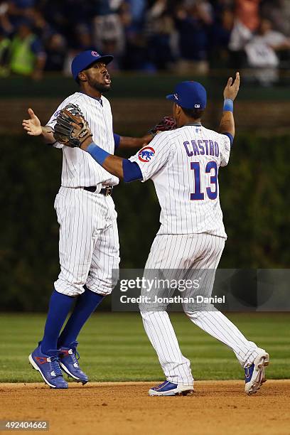 Dexter Fowler of the Chicago Cubs celebrates with Starlin Castro of the Chicago Cubs after defeating the St. Louis Cardinals in game three of the...