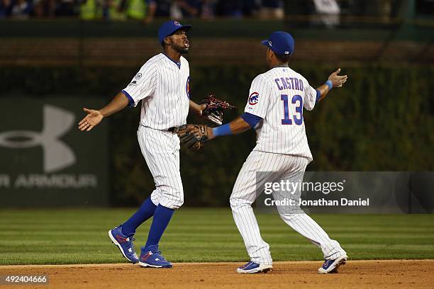 Dexter Fowler of the Chicago Cubs celebrates with Starlin Castro of the Chicago Cubs after defeating the St. Louis Cardinals in game three of the...