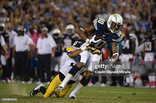 Wide receiver Malcom Floyd of the San Diego Chargers makes a reception while defended by defensive back Ross Cockrell of the Pittsburgh Steelers at...