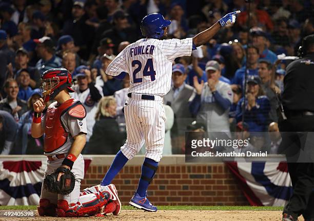 Dexter Fowler of the Chicago Cubs reacts after hitting a solo home run in the eighth inning against the St. Louis Cardinals during game three of the...