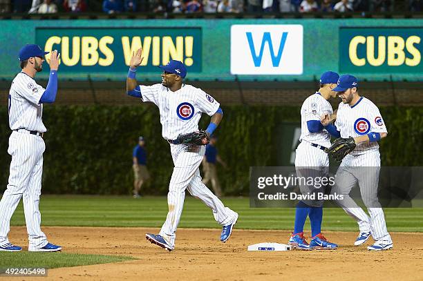 Kris Bryant of the Chicago Cubs, Austin Jackson of the Chicago Cubs, Javier Baez of the Chicago Cubs, and Chris Denorfia of the Chicago Cubs...