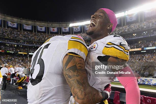 Running back Le'Veon Bell of the Pittsburgh Steelers celebrates with running back Roosevelt Nix of the Pittsburgh Steelers after Bell scored the...