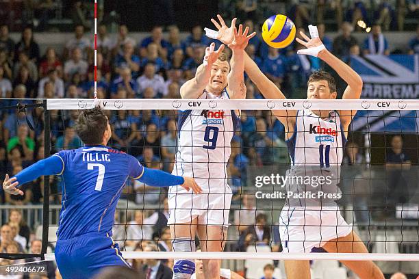 Ivan Zaytsev , Simone Buti , blocks the ball from middle-blocker Tillie , during CEV Volleyball European Championship pool B match between France and...