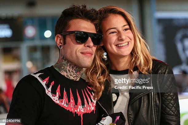 Fedez poses for a picture with his fan. The Italian rapper Fedez has met hundreds of his fans to autograph the repack album "Pop-Hoolista", titled...