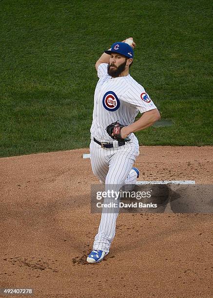 Jake Arrieta of the Chicago Cubs throws a pitch in the first inning against the St. Louis Cardinals during game three of the National League Division...