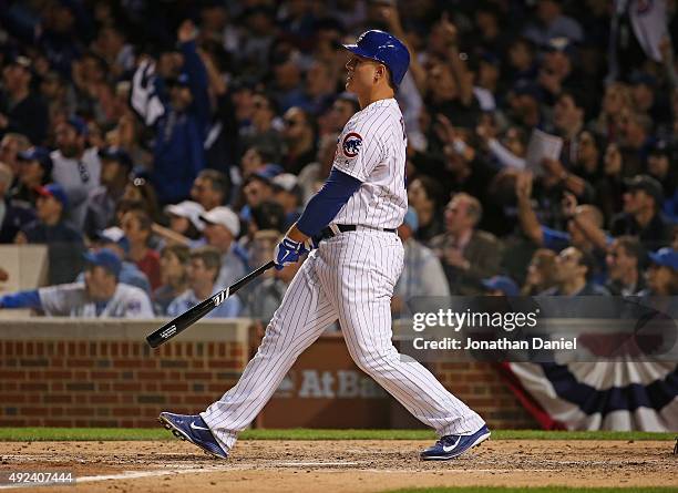 Anthony Rizzo of the Chicago Cubs follows the flight of his solo home run in the 5th inning against the St. Louis Cardinals during game three of the...