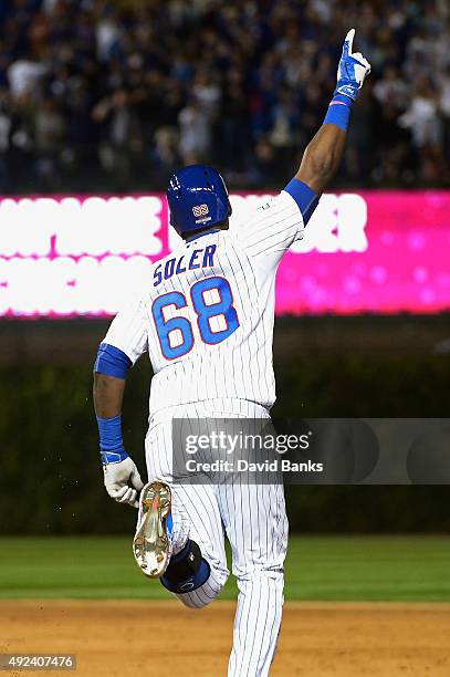 Jorge Soler of the Chicago Cubs runs the bases after hitting a two-run home run in the sixth inning against the St. Louis Cardinals during game three...