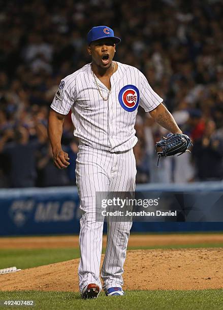 Pedro Strop of the Chicago Cubs celebrates after striking out the side in the 8th inning against the St. Louis Cardinals during game three of the...