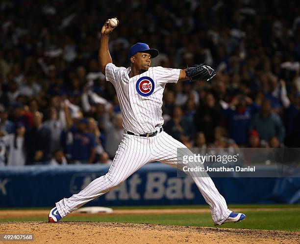 Pedro Strop of the Chicago Cubs pitches in the 8th inning against the St. Louis Cardinals during game three of the National League Division Series at...