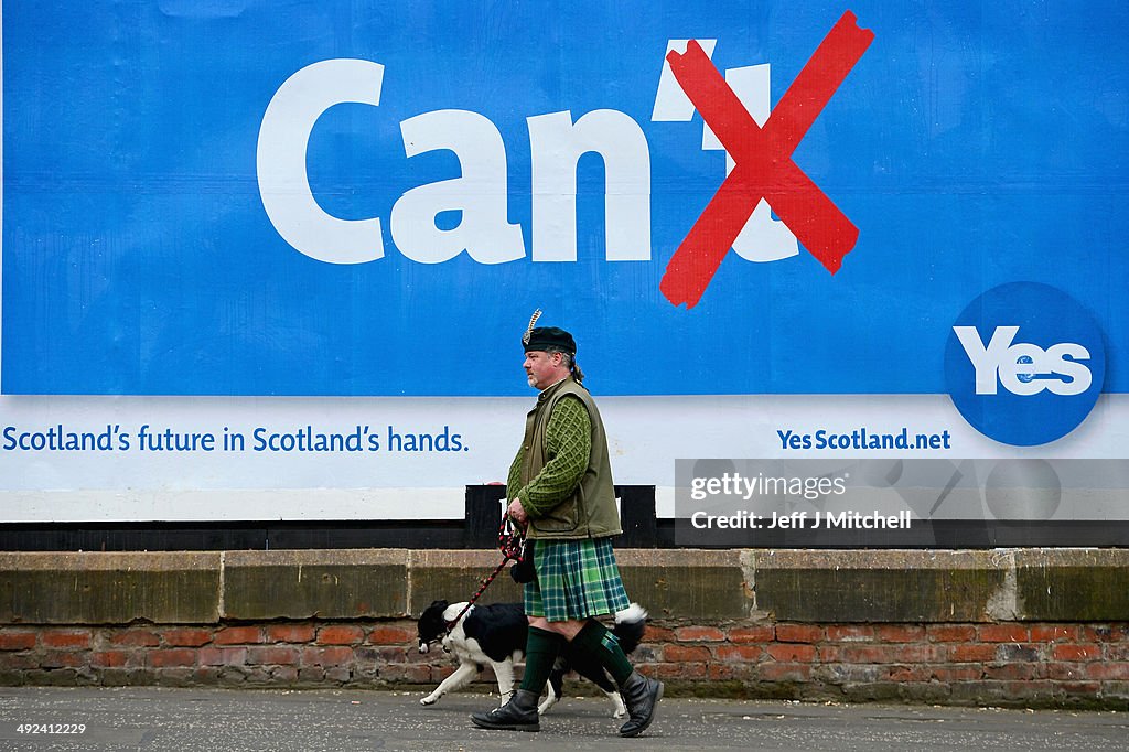 Collin Provan Colin MacDonald Provan walks his dog Colleen down Glasgow High Street ...