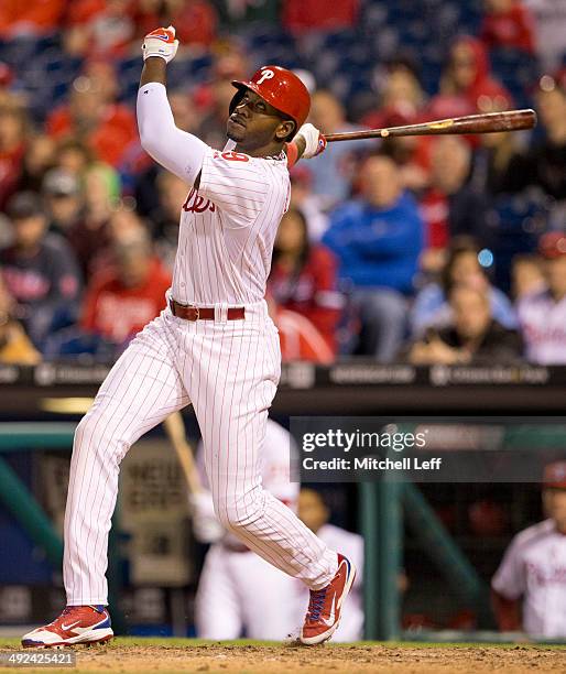 Left fielder Domonic Brown of the Philadelphia Phillies swings the bat against the Washington Nationals on May 2, 2014 at Citizens Bank Park in...