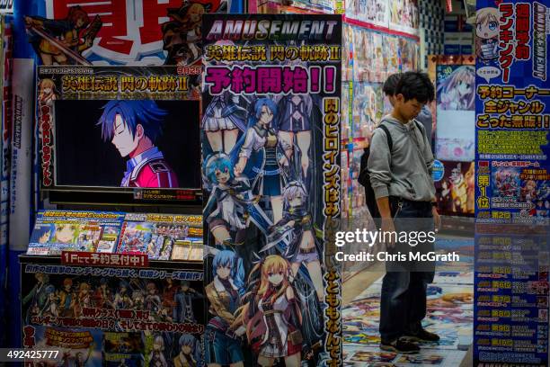 Man looks at DVD's at a shop in Akihabara, Electric Town on May 20, 2014 in Tokyo, Japan. Akihabara gained the nickname Akihabara Electric Town after...