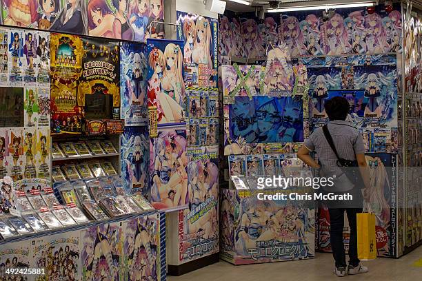 Man looks at products in a store in Akihabara, Electric Town on May 19, 2014 in Tokyo, Japan. Akihabara gained the nickname Akihabara Electric Town...