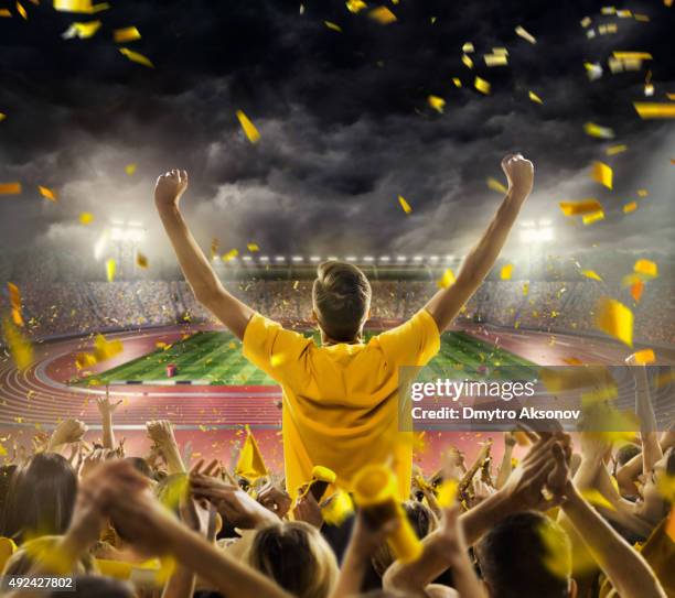 fans at . stadium with running tracks - legends of football stock pictures, royalty-free photos & images