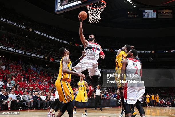 Nene Hilario of the Washington Wizards drives to the basket against the Indiana Pacers in Game Six of the Eastern Conference Semifinals during the...