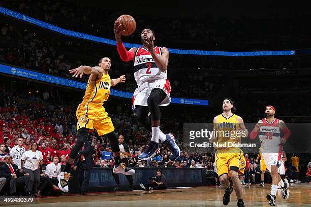 John Wall of the Washington Wizards drives to the basket against the Indiana Pacers in Game Six of the Eastern Conference Semifinals during the 2014...