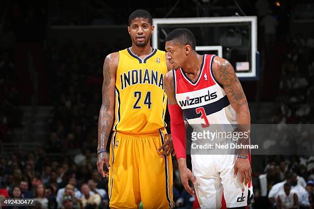 Paul George of the Indiana Pacers and Bradley Beal of the Washington Wizards stand on the court in Game Six of the Eastern Conference Semifinals...