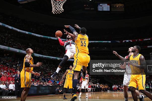 John Wall of the Washington Wizards drives to the basket against the Indiana Pacers in Game Six of the Eastern Conference Semifinals during the 2014...