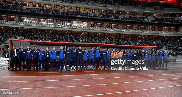 Antonio Conte and the Italy bench stand for the national anthem before the UEFA Euro 2016 qualifying football match between Azerbaijan and Italy at...