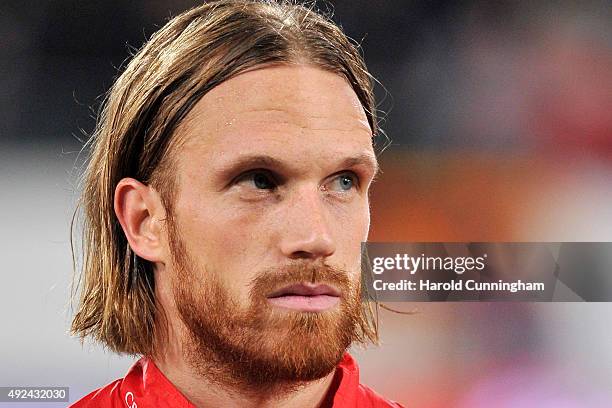 Michael Lang of Switzerland looks on during the anthem prior to the UEFA EURO 2016 qualifier between Switzerland and San Marino at AFG Arena on...