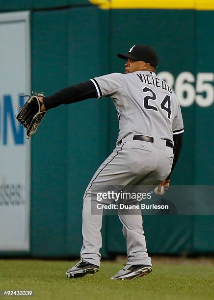 Right fielder Dayan Viciedo of the Chicago White Sox throws in a ball during a game against the Detroit Tigers at Comerica Park on May 5, 2014 in...