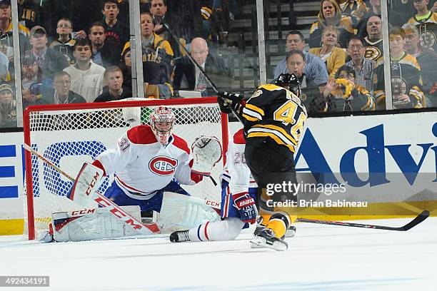 David Krejci of the Boston Bruins shoots the puck against Carey Price of the Montreal Canadiens in Game Seven of the Second Round of the 2014 Stanley...