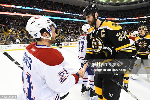 Zdeno Chara of the Boston Bruins shakes hands with Brian Gionta of the Montreal Canadiens in Game Seven of the Second Round of the 2014 Stanley Cup...