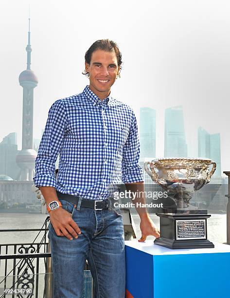 In this handout provided by Tennis Australia, Rafael Nadal poses with the Norman Brookes Challenge Cup during the international launch of the...