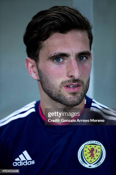 Graeme Shinnie of Scotland listens to his National anthem at the bench prior to start the UEFA EURO 2016 Qualifying round Group G match between...