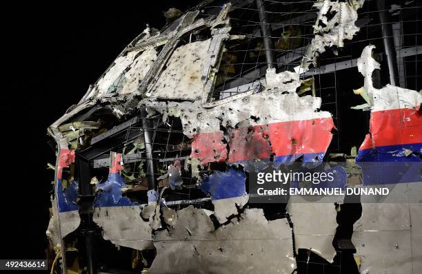 The wrecked cockipt of the Malaysia Airlines flight MH17 is exhibited during a presentation of the final report on the cause of the its crash at the...