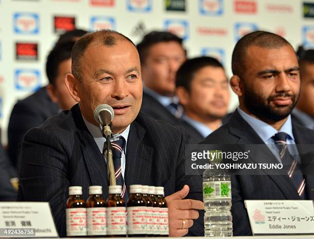 Japan's rugby team head coach Eddie Jones speaks to the press as captain Michael Leitch looks on in Tokyo on October 13 following their return from...