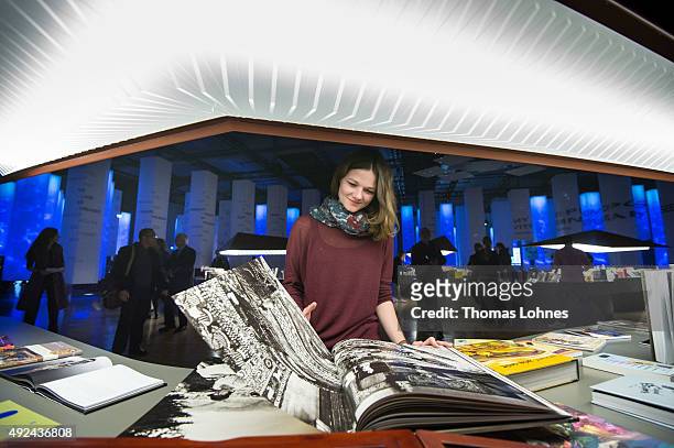 Woman attends the exhibiton of the guest country Indonesia at the 2015 Frankfurt Book Fair on October 13, 2015 in Frankfurt am Main, Germany. The...