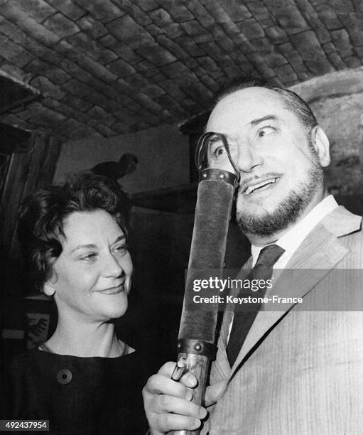 Pierre Brasseur holding the 'Prix du Brigadier' which awards the theatrical event of the year and Maria Casares after the declaration of the result...