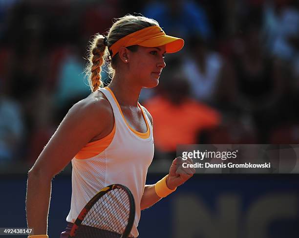 Eugenie Bouchard of Canada celebrates a point during her match against Anastasia Rodionova of Australia during Day 4 of the Nuernberger...