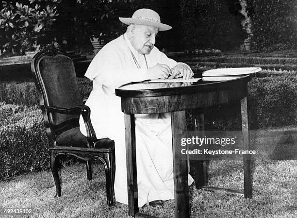 Pope John XXIII working in the gardens of the Papal Palace of Castel Gandolfo on May 24, 1963 in Castel Gandolfo, Italy.