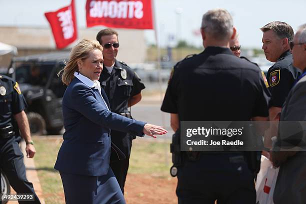 Oklahoma Governor Mary Fallin greets people during the remembrance ceremony for the victims of last year's tornado on May 20, 2014 in Moore,...