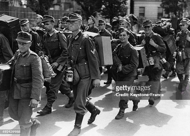 Group of German soldiers coming from the Channel Island of Alderney, where 600-700 people were murdered in a concentration camp on May 22, 1945 in...