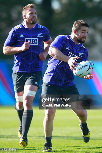 Dane Coles of the All Blacks passes during a New Zealand All Blacks training session at Swansea University on October 13, 2015 in Swansea, United...