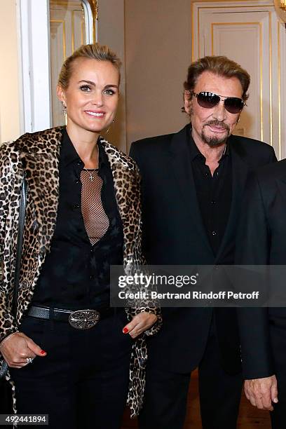 Singer Johnny Hallyday and his wife Laeticia attend Harvey Keitel receives the Medal of Commander of Arts and Letter at Ministere de la Culture on...