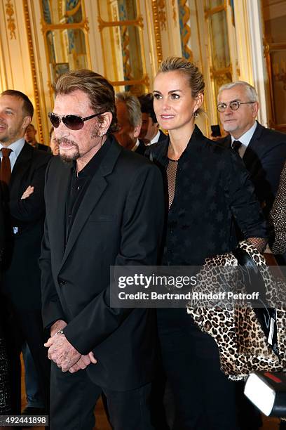 Singer Johnny Hallyday and his wife Laeticia attend Harvey Keitel receives the Medal of Commander of Arts and Letter at Ministere de la Culture on...