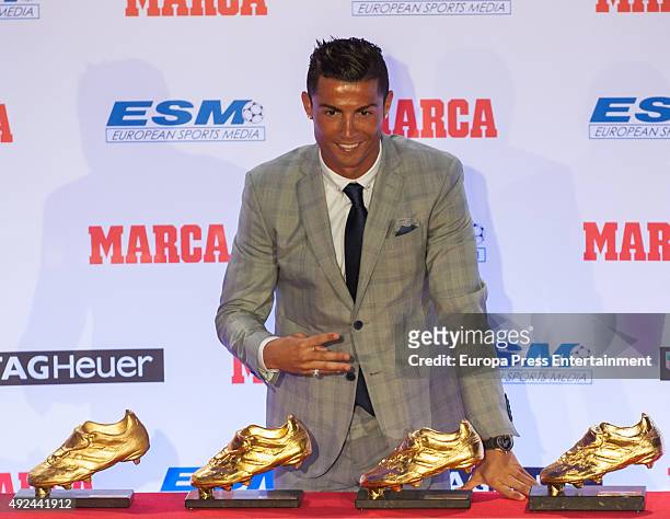 Real Madrid football player Cristiano Ronaldo receives his fourth Golden Boot Award as the highest goal scorer of the European leagues on October 13,...