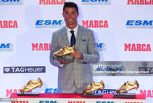 Real Madrid football player Cristiano Ronaldo receives his fourth Golden Boot Award as the highest goal scorer of the European leagues on October 13,...