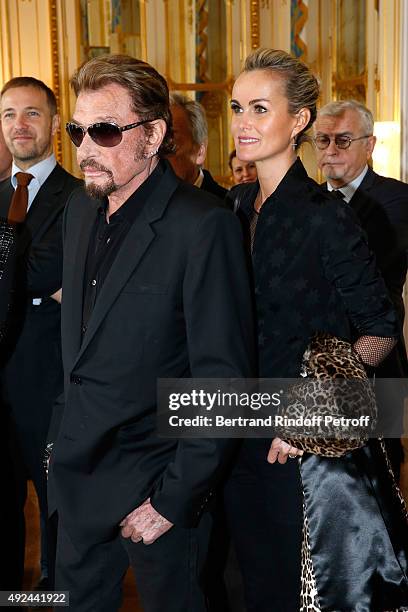 Singer Johnny Hallyday and his wife Laeticia attend Harvey Keitel receives the Medal of Commander of Arts and Letter at Ministere de la Culture on...