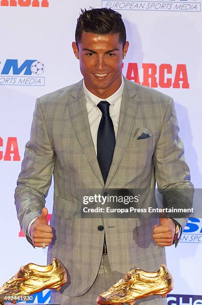 Real Madrid football player Cristiano Ronaldo receives his fourth Golden Boot Award as the highest goal scorer of the European leagues on October 13,...