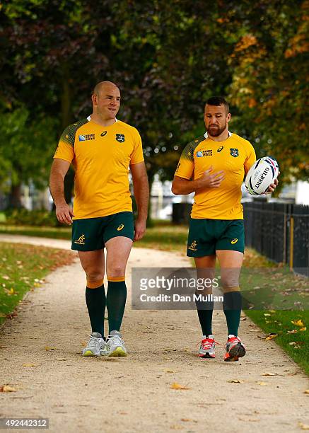 Stephen Moore of Australia and Matt Giteau of Australia take a walk during an Australia media session at The Lensbury Hotel on October 13, 2015 in...